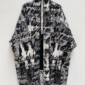 Close up of frontside of black and white silk blend jacquard oversized kimono coat