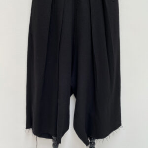 close up of unisex oversized light woolen black pants with double pleats at the waistband