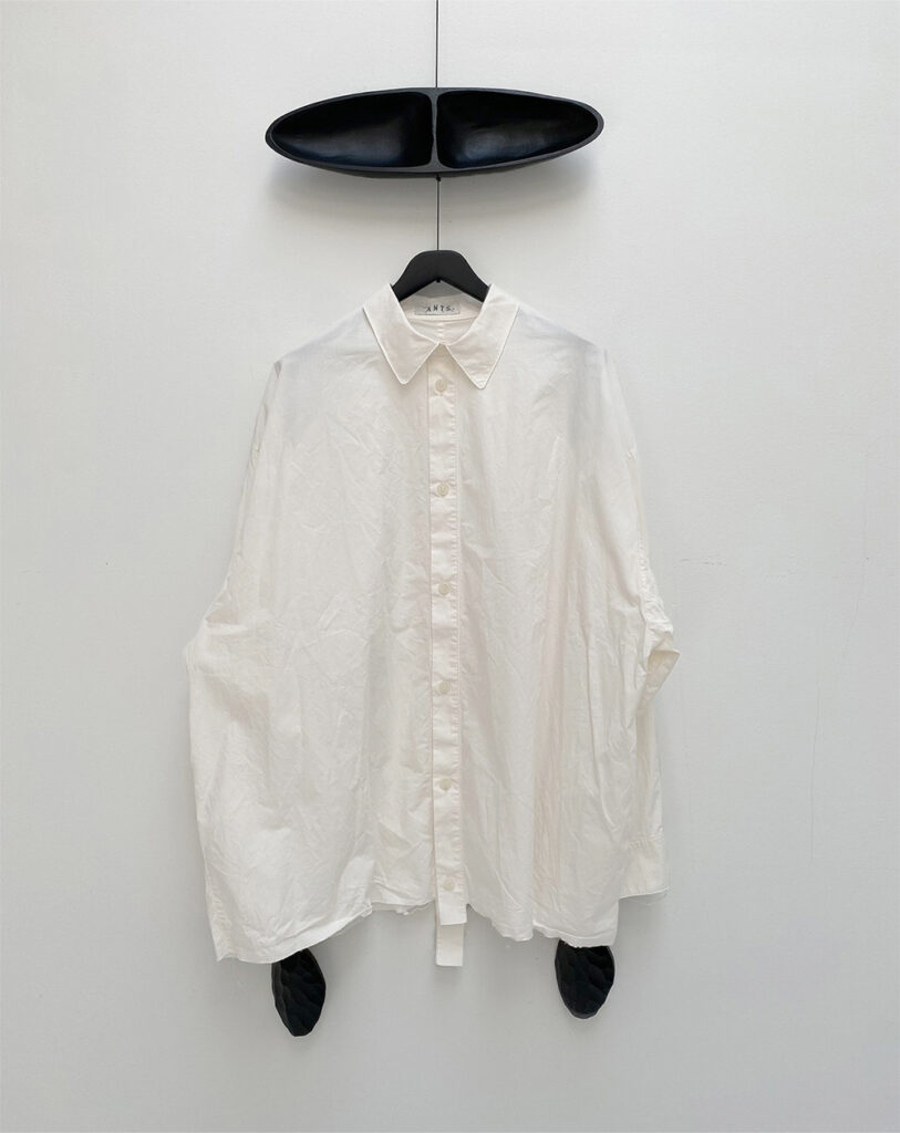 Frontside of oversized shirt in off white organic cotton poplin