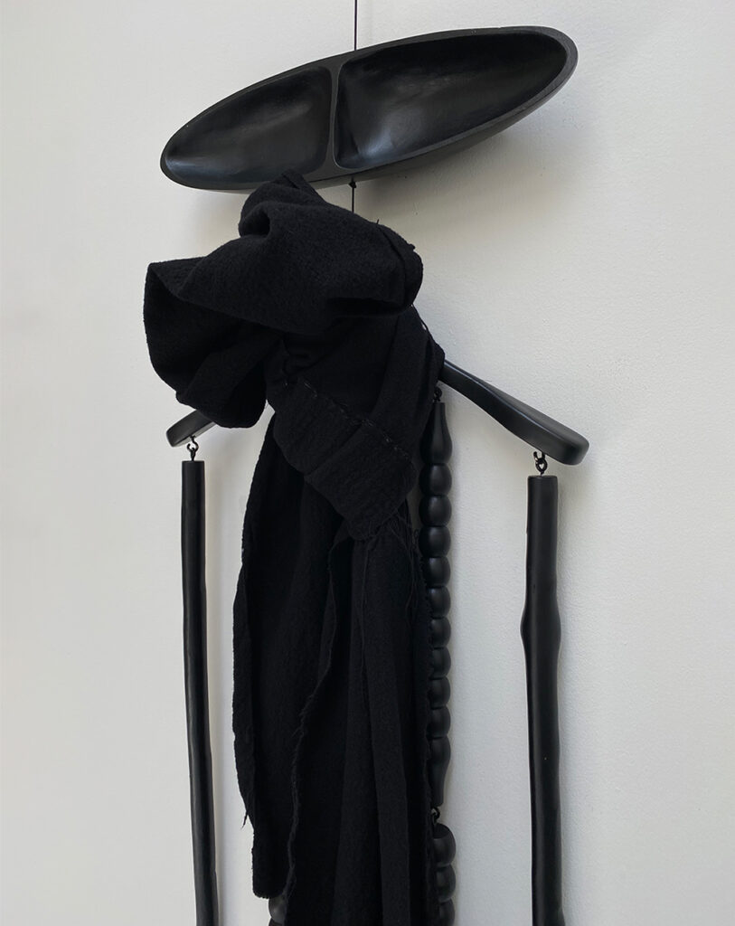 Oversized boiled woolen scarf with raw edges