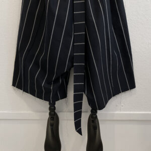 Cropped image of the legs of oversized striped pants