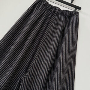 Close up of waistband with drawcord of oversized cropped pants in wool melange stripe