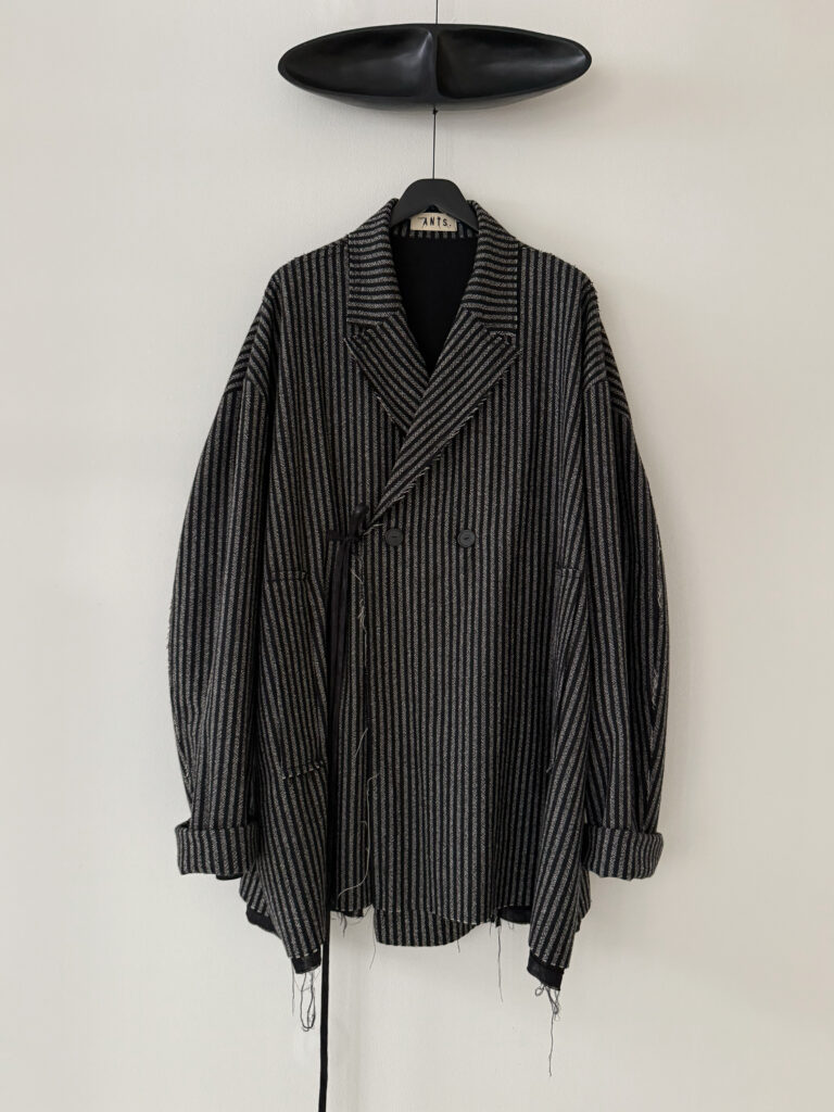 Frontside of oversized double breasted striped wool unisex blazer